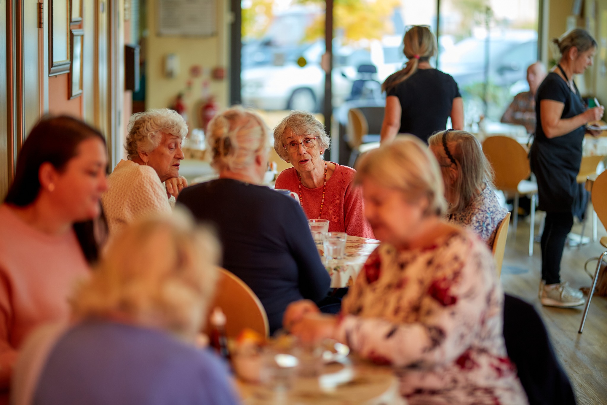 Older people enjoying a meal together.